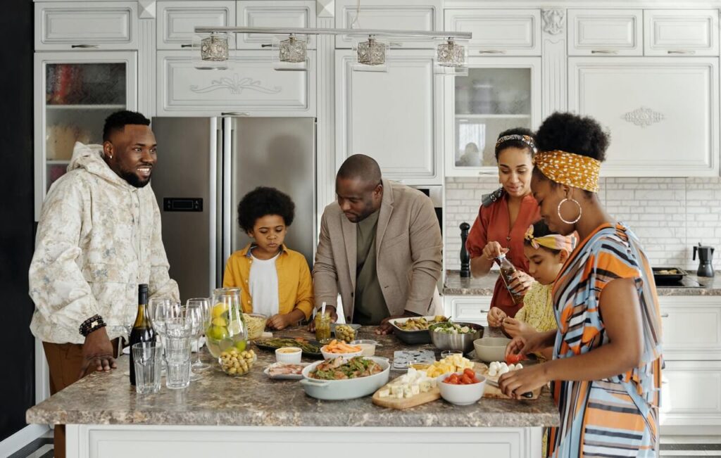 Family preparing food in the kitchen