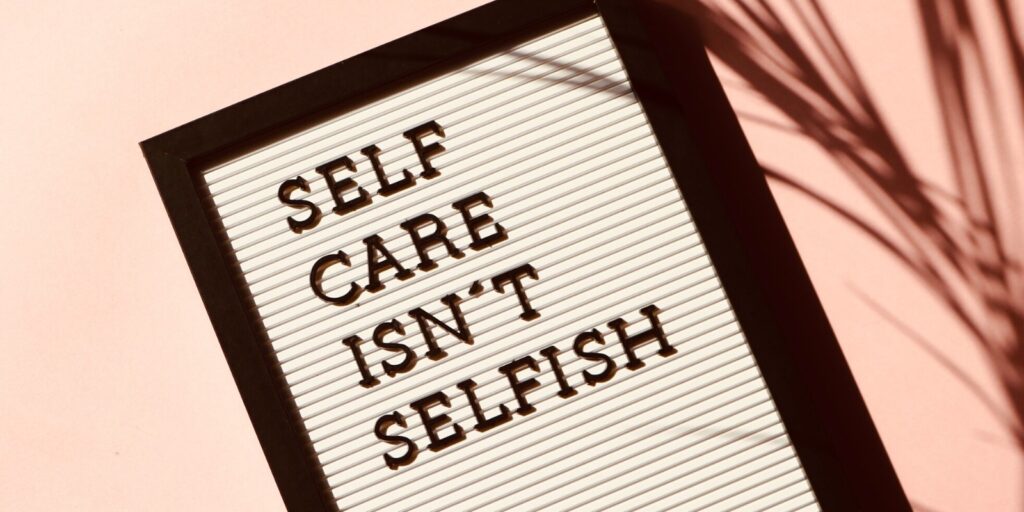 A frame with text written as Self Care Isn't Selfish