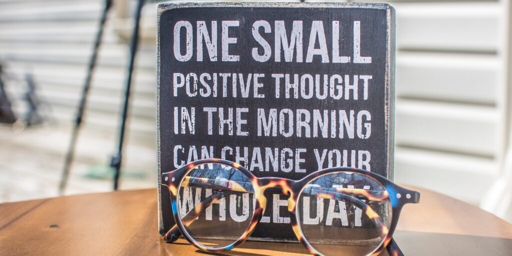 A small black board with text as, One small positive thought in the morning can change your whole day.