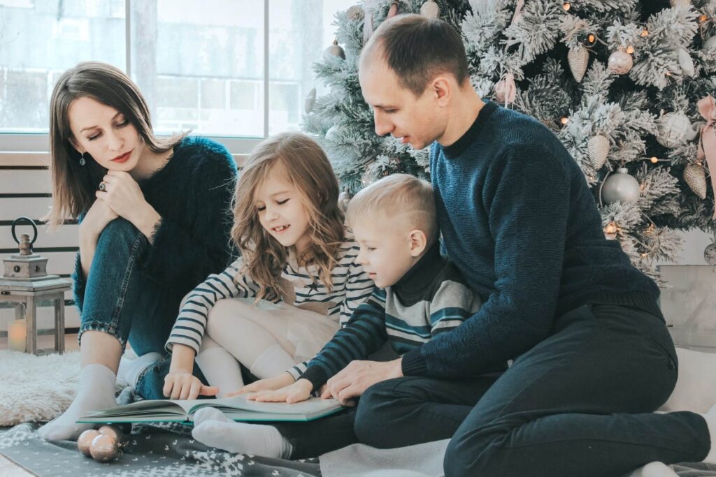 Family enjoying reading a book