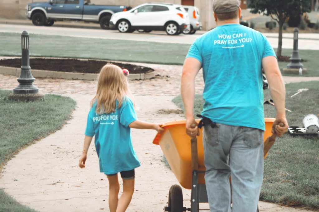 Father and daughter helping and volunteering
