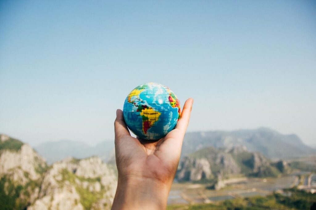 person holding world globe health archives