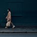 Coronavirus Pandemic Will Give Rise To A Disabled Generation 7 woman walking on footpath wearing mask