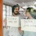 Coronavirus Cases Surge Across India and South Africa 7 Couple holding display cards with message to Stay at Home