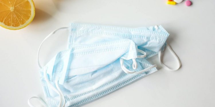 Immunity To COVID-19 May Disappear In Few Months 1 Face masks, medicines, and lemon slices on a white background