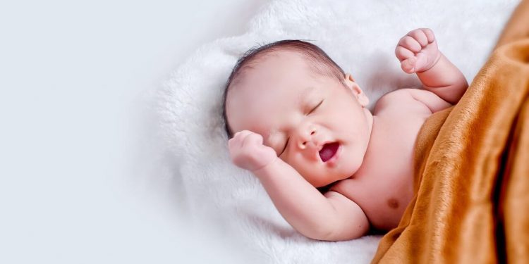 Coronavirus: Mothers Unlikely To Infect Baby During Childbirth 1 Image of a Newborn baby lying on fur pillow in brown blanket