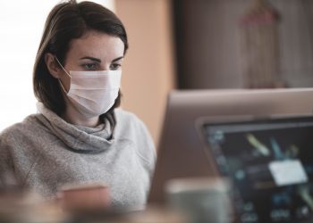 woman working and wearing mask