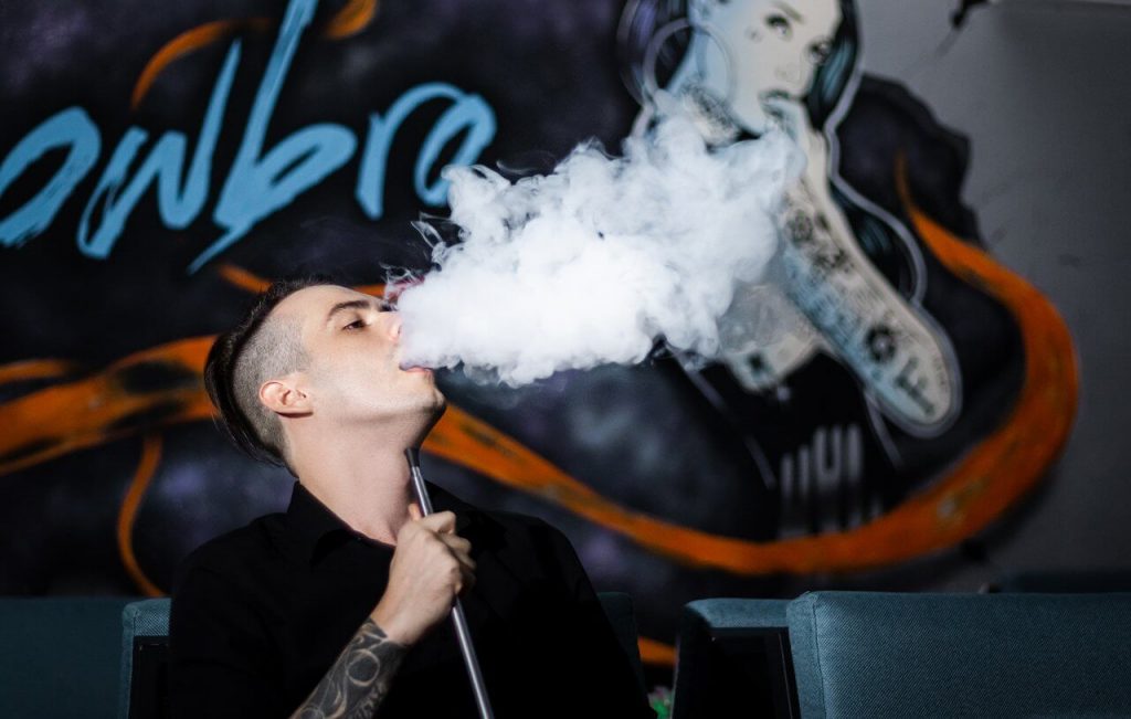 Image of man smoking vape
