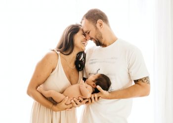 Not Every Woman Needs A Pain Reliever During Childbirth 11 Image of Mother and father holding newborn baby and laughing
