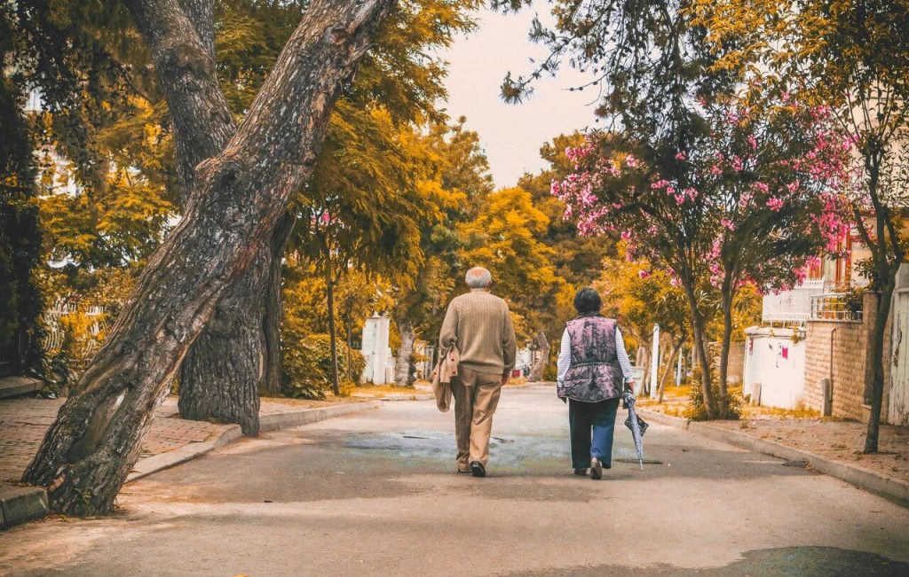 Image of Old Man and Woman Walking on the street