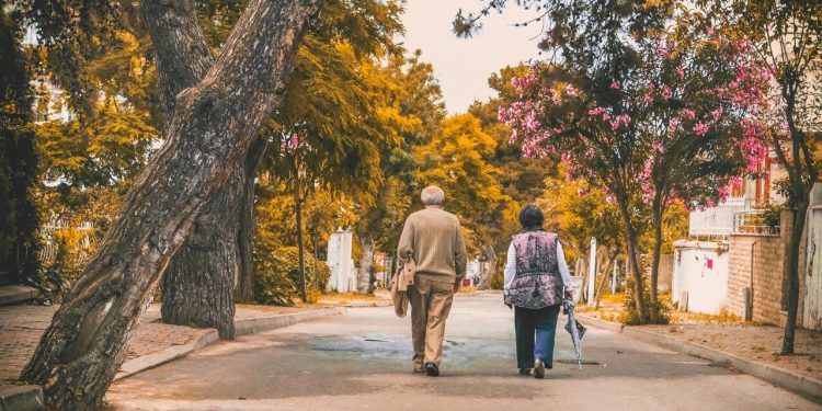 Image of Old Man and Woman Walking on the street
