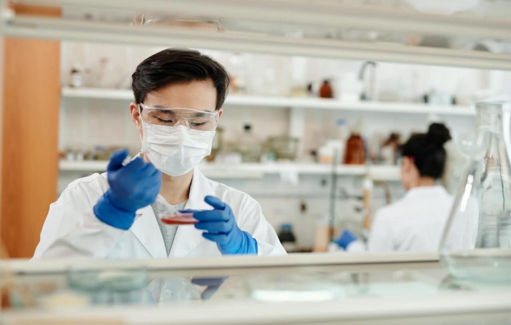 Image of a Scientist conducting a sample test in Laboratory