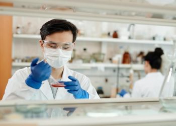 Breakthrough In Protein Treatment Trial For Coronavirus 12 Image of a Scientist conducting a sample test in Laboratory