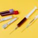 Australian Researchers Devised 20-Minute Coronavirus Blood Test 7 Syringes and blood test tube samples on a yellow background