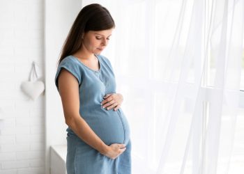 Marijuana Use In Pregnancy Might Cause Autism In Newborn, Study Says 12 Pregnant woman wearing blue frock standing in her room