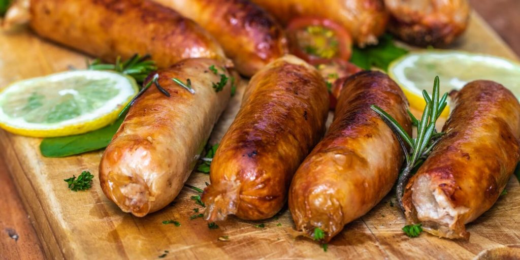 Cooked sausage on a wooden board