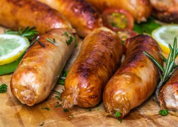 Sausage And Bratwurst May Be Contaminated With Disease-Causing Bacteria, USDA Alerts Public 11 Cooked sausage on a wooden board