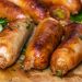 Sausage And Bratwurst May Be Contaminated With Disease-Causing Bacteria, USDA Alerts Public 7 Cooked sausage on a wooden board