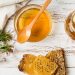 Honey Beats Antibiotics For Treatment Of Cough And Cold 11 Image of Honey jar with honeycomb on a solid surface with herbs