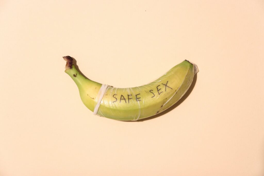A banana with condom written 'Safe Sex'