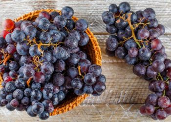 Benefits of Healthy Foods Rich in Antioxidants 36 Purple grapes in basket on a wooden background