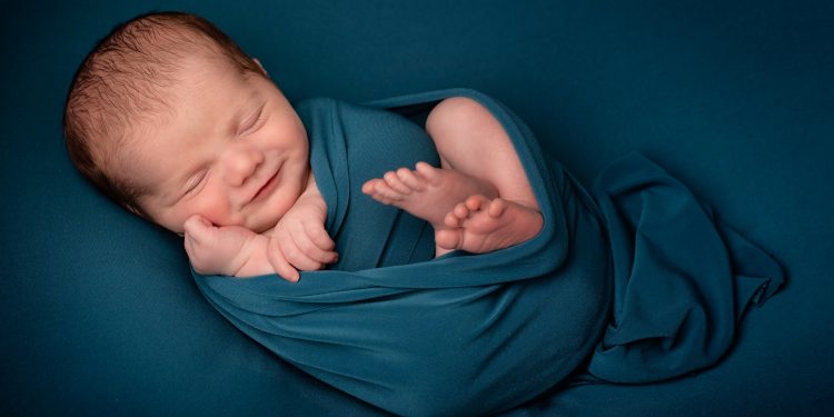 A study says newborns’ brains have similarities to adults 1 A photo of a beautiful child smiling during photoshoot