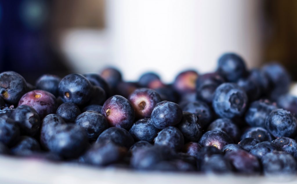 A photo showing a bunch of Acai berry in a bowl