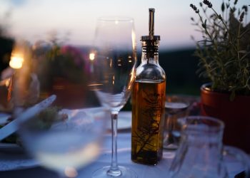 Moroccan Olive Oil Health Benefits  11 Olive oil bottle placed on a dinner table