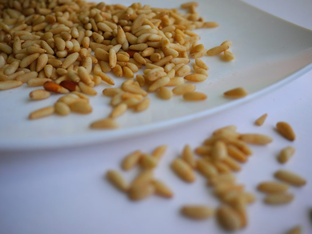 Pine Nuts without shells ready to eat in a plate